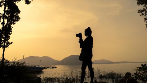 Silhouette of a female photographer at Chandil Dam